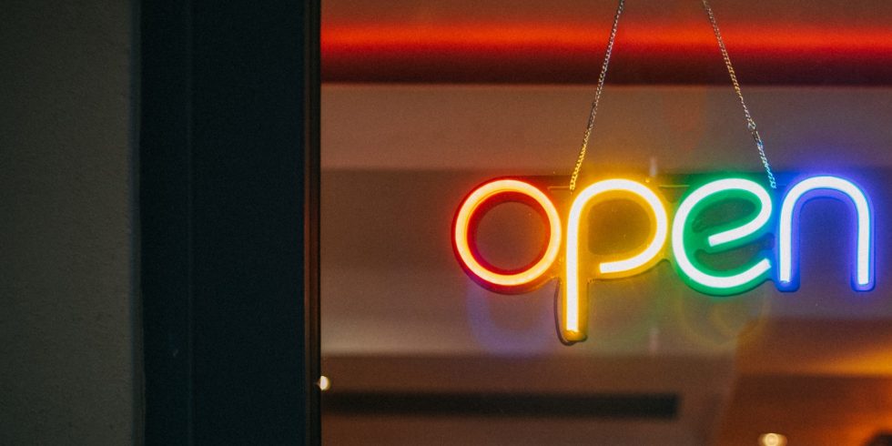 Neon sign reading Open